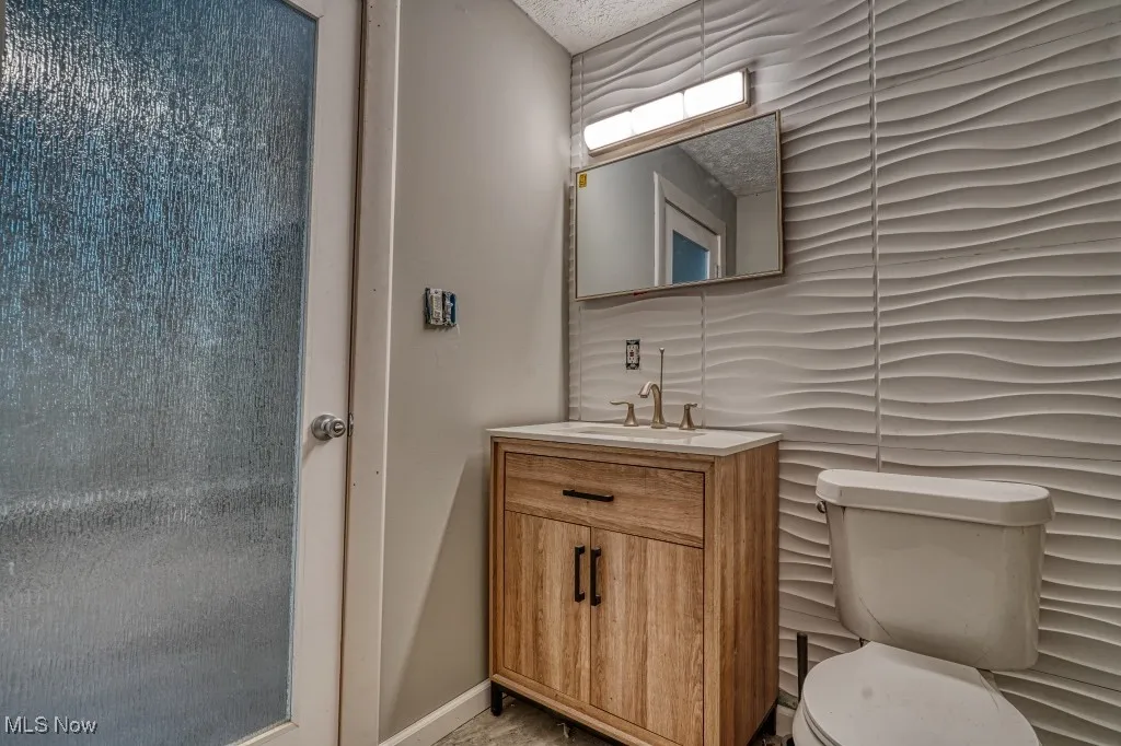 Master Bathroom featuring toilet and vanity