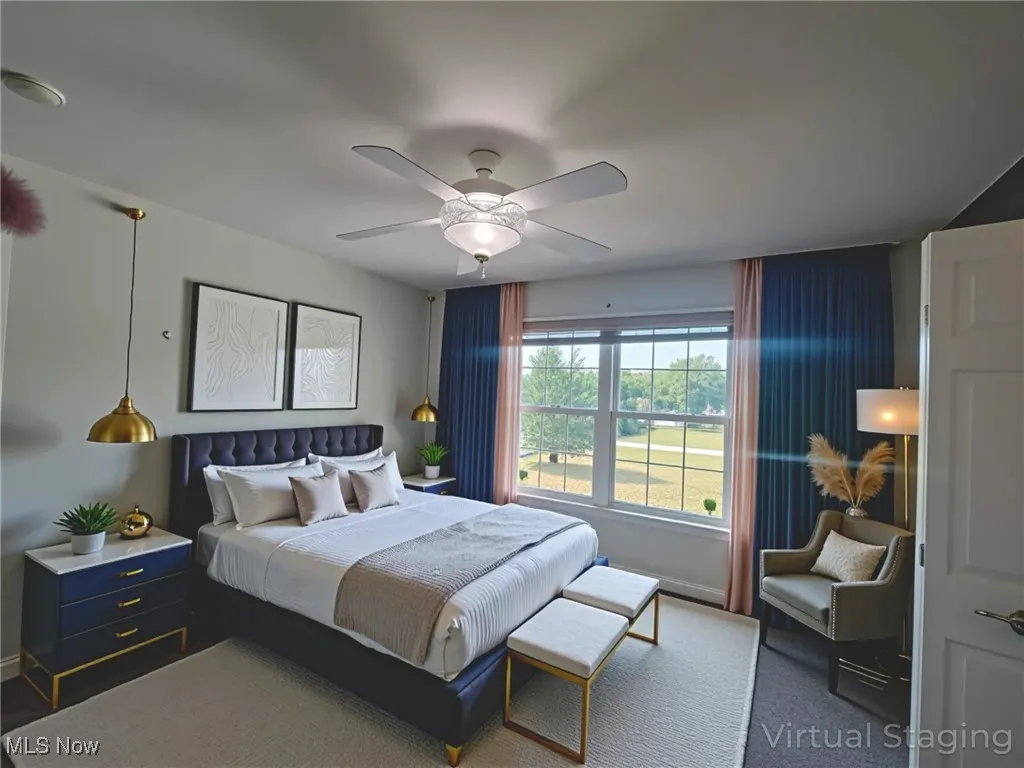 Bedroom with ceiling fan and NEW carpet - virtually staged