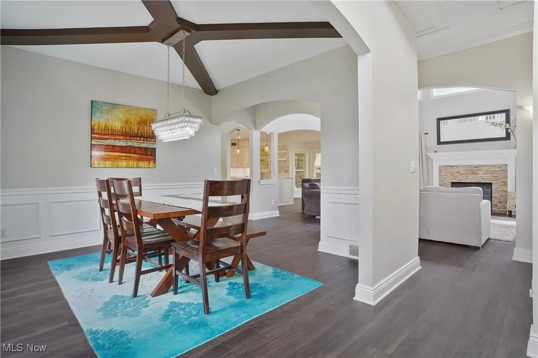 Dining area with arched walkways, wainscoting, new lvt floors