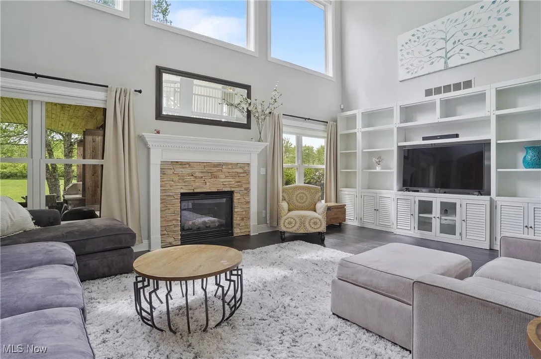 great room with fireplace and entertainment center