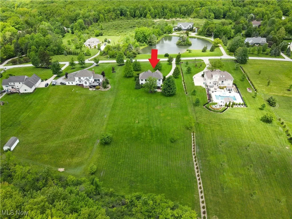 Drone / aerial view of a pod and a heavily wooded area