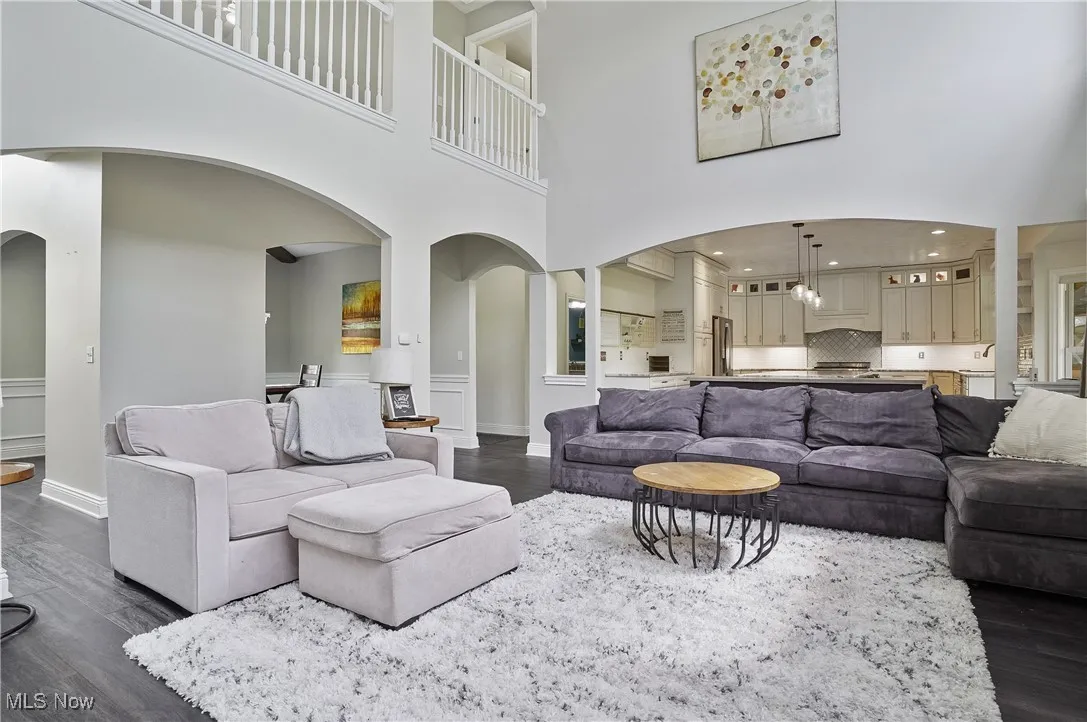 two story great room open to cat walk above and gourmet kitchen