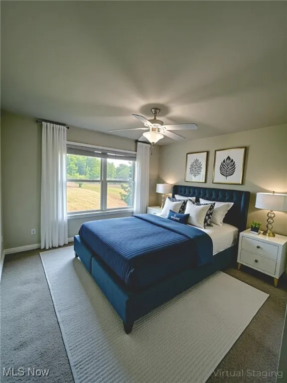 bedroom with a ceiling fan and NEW carpet - virtually staged
