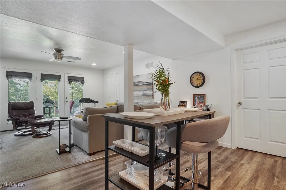 Dining room featuring ceiling fan, wood finished floors, and recessed lighting
