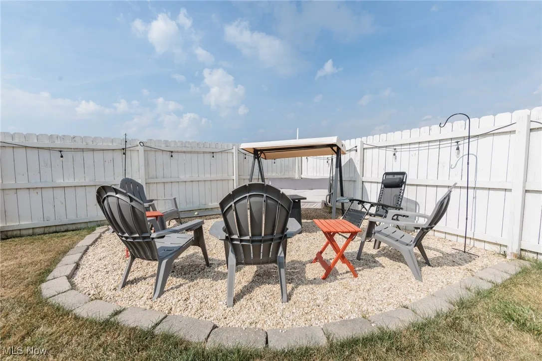 Fenced backyard with a patio area