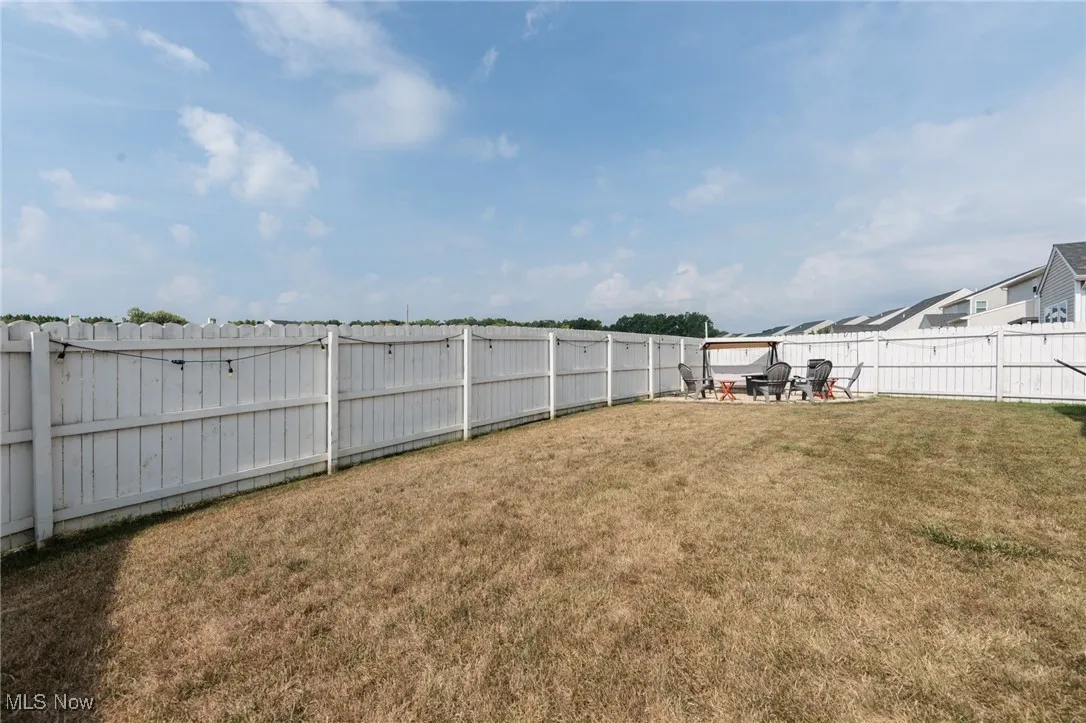 Fenced backyard featuring a patio area