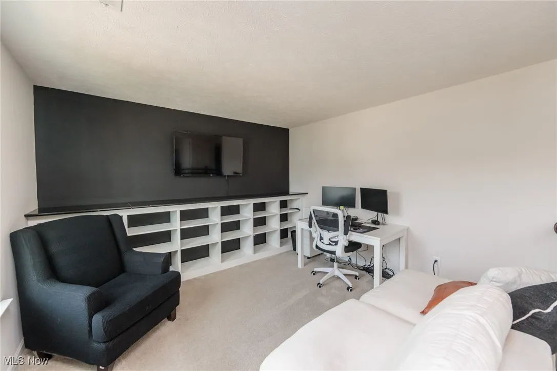 View of carpeted home office