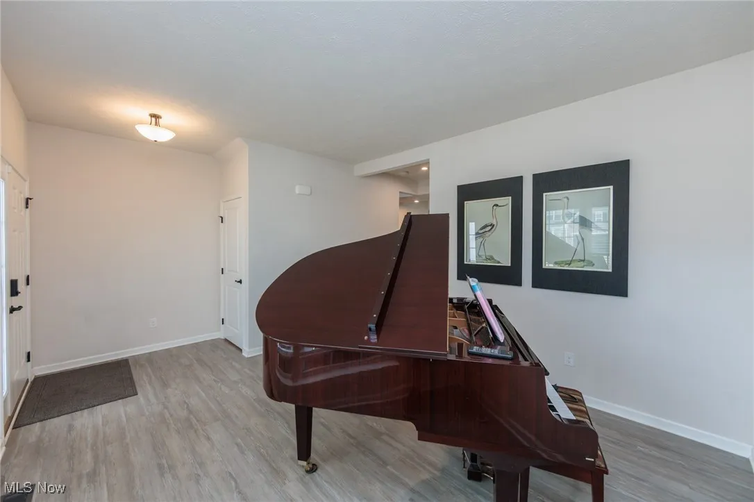 Sitting room featuring wood finished floors and baseboards
