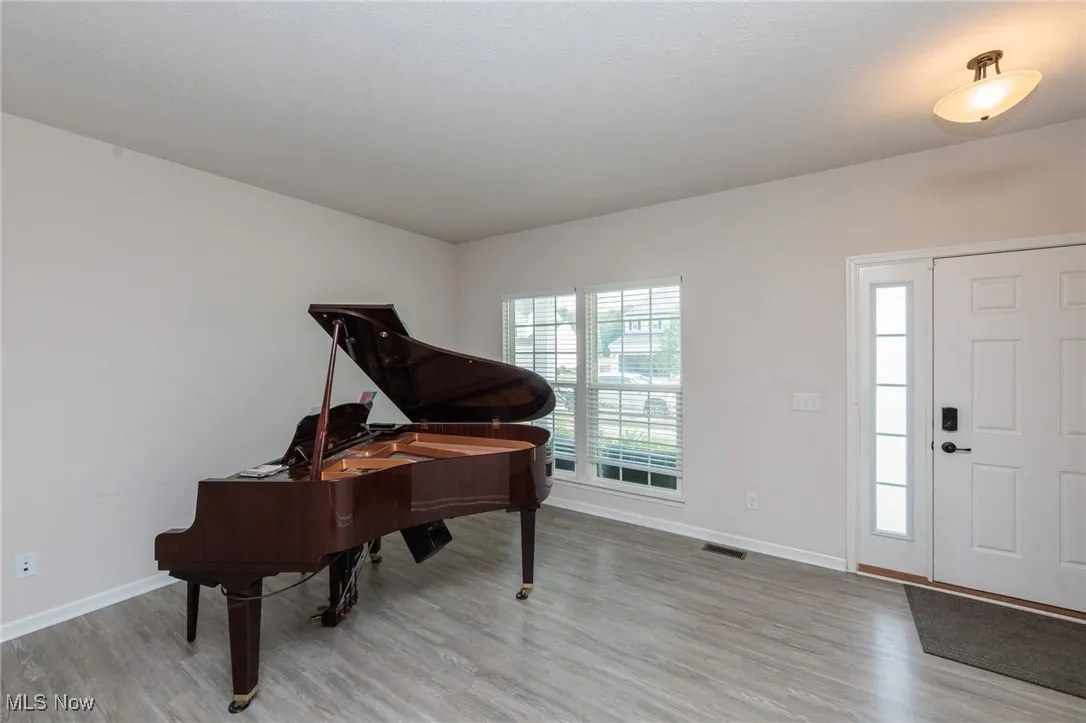 Foyer with wood finished floors
