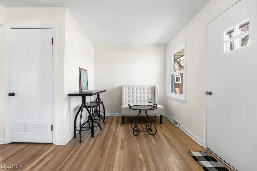 Fresh paint and freshly refinished hardwood floors extend through much of the home