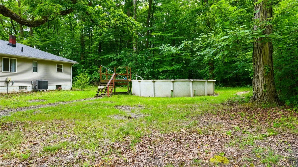 View of yard featuring an outdoor pool