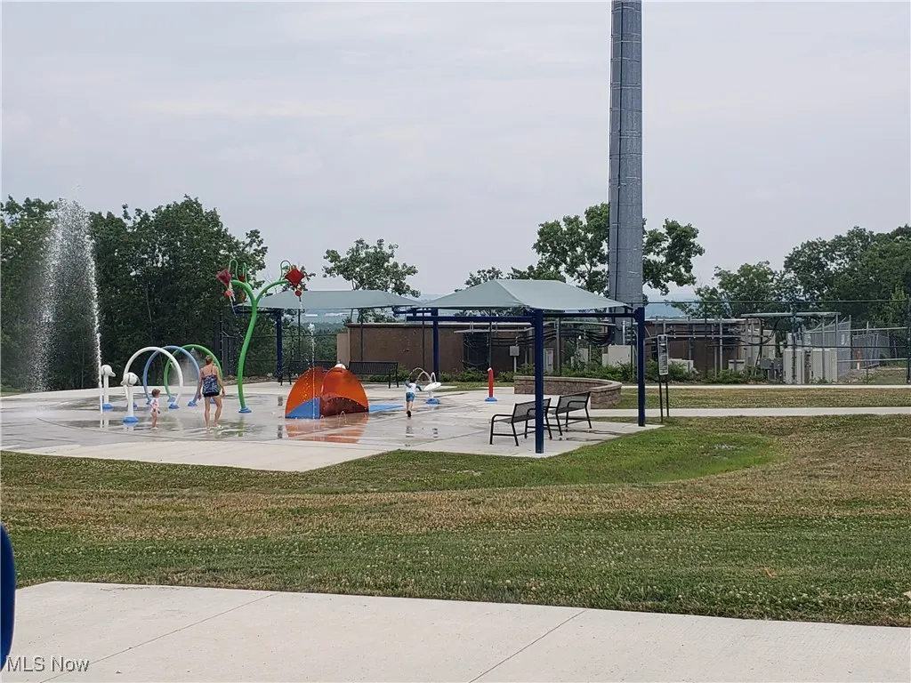 View of jungle gym featuring a gazebo and a yard