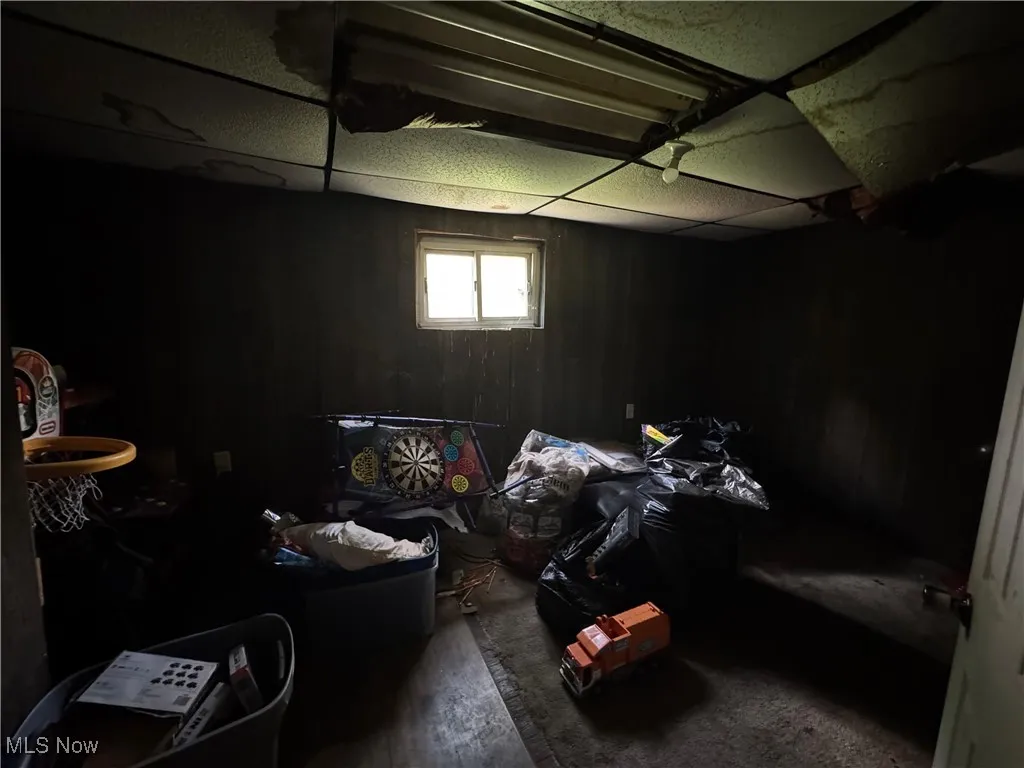 Basement featuring a paneled ceiling