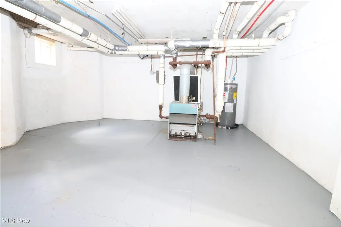 Basement featuring electric water heater