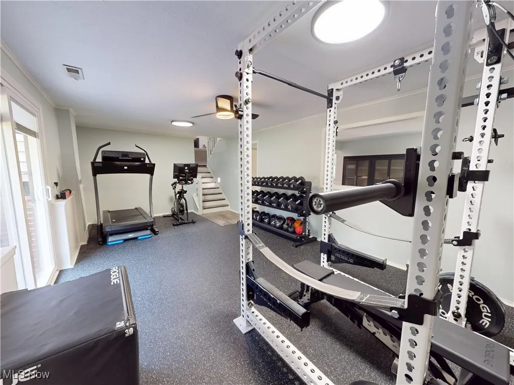 Workout area featuring baseboards