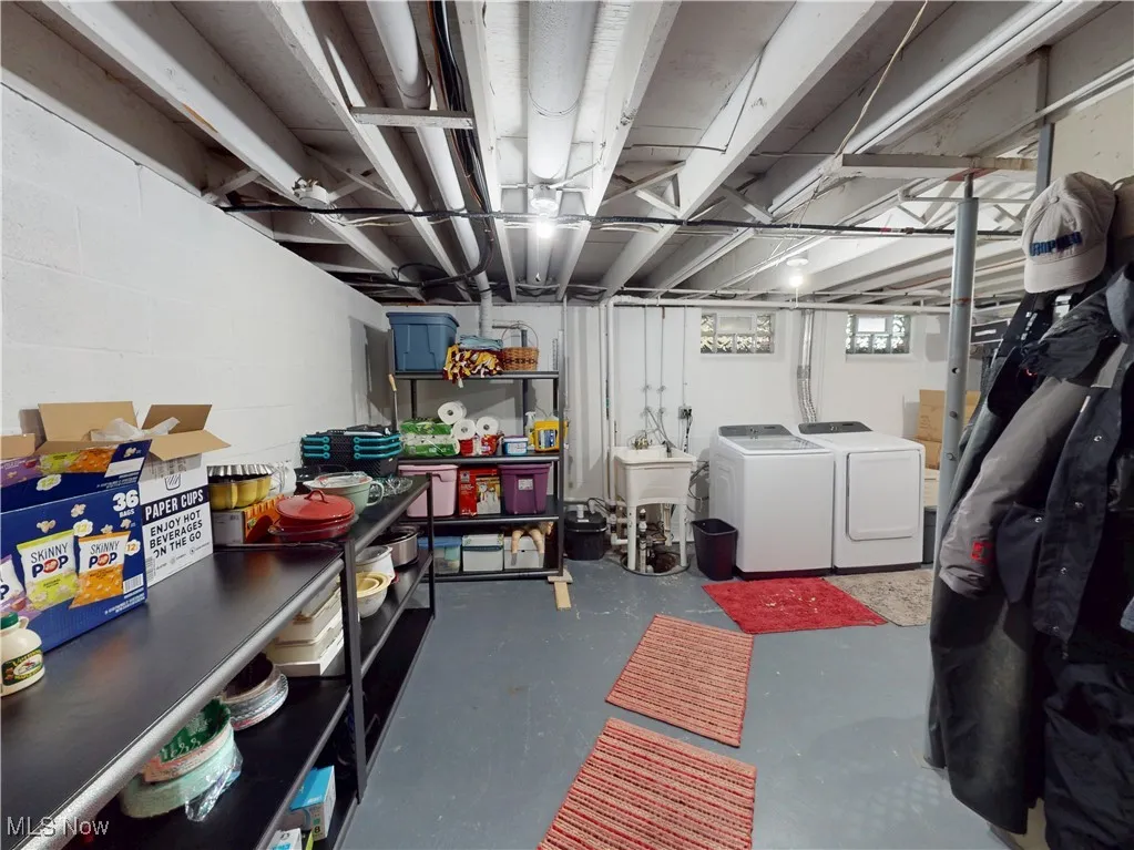 Below grade area with washing machine and clothes dryer