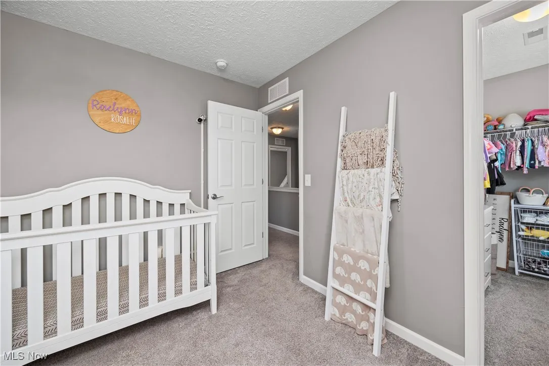 Bedroom is currently or has been used for the nursery, shows its large closet for this bedroom