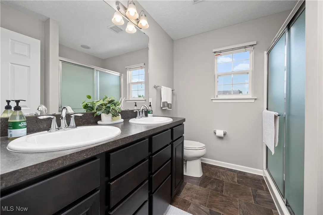 Primary Bathroom with dual vanities