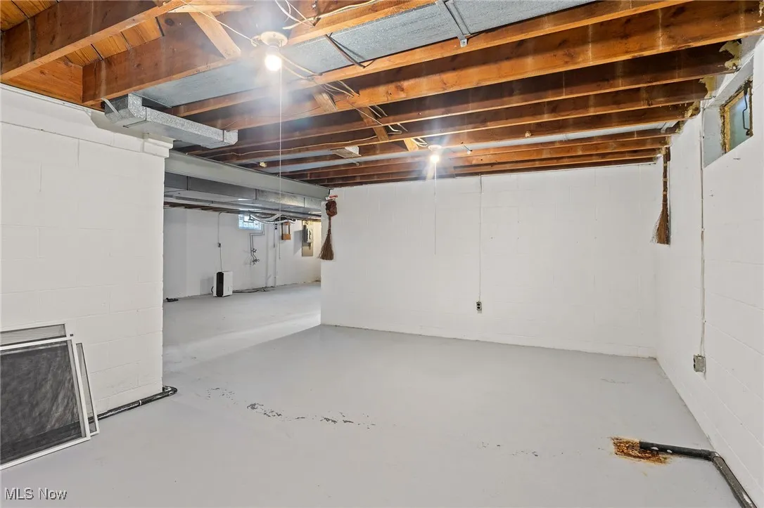 Unfinished below grade area with concrete block walls