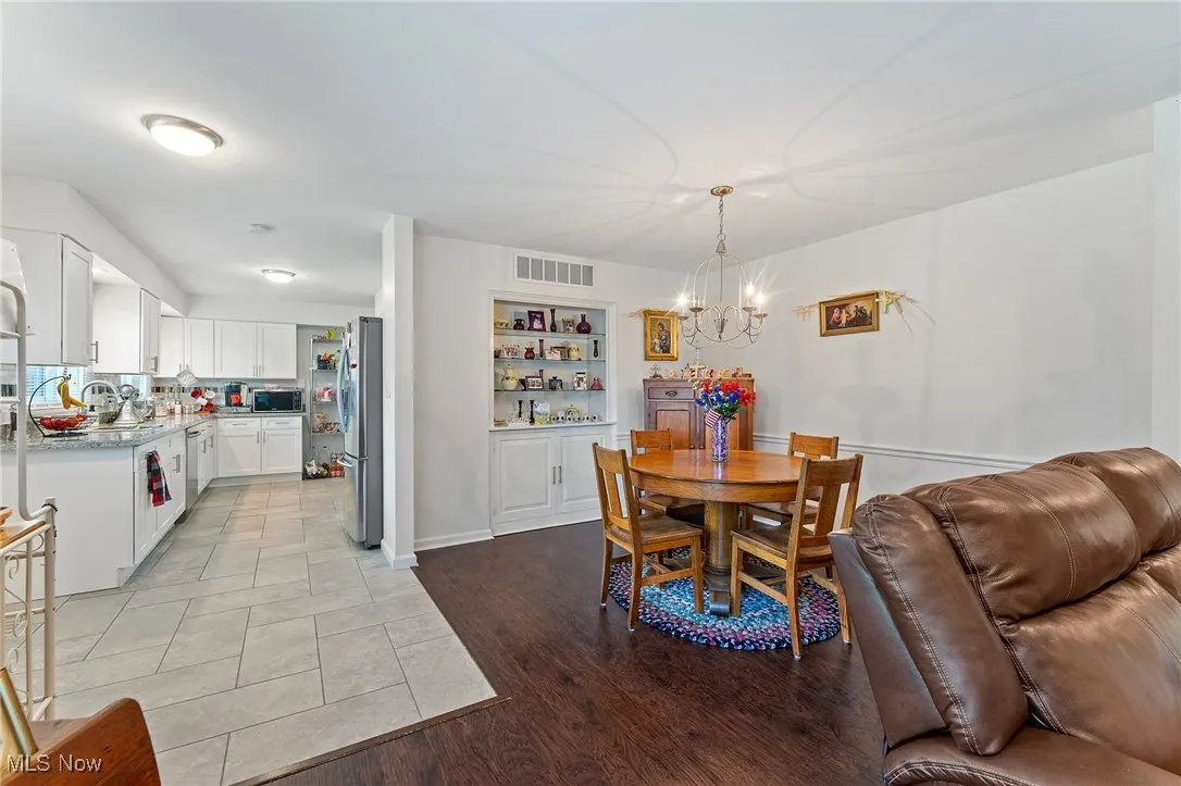 Dining area featuring a chandelier and built in features