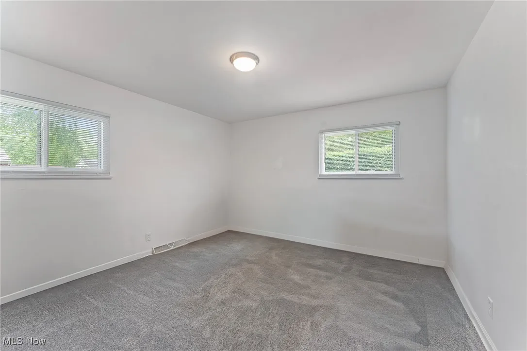 Unfurnished room featuring carpet floors