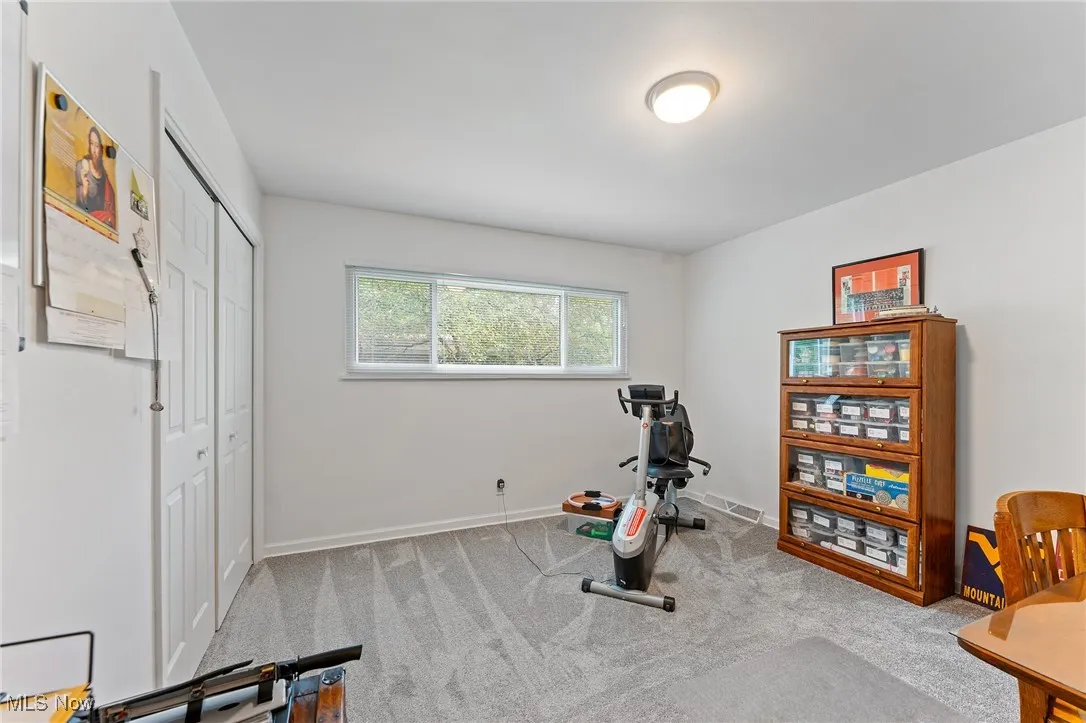 Bedroom with carpet floors and baseboards