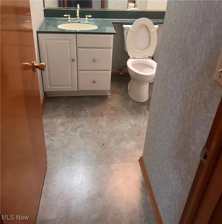 Bathroom with vanity and toilet