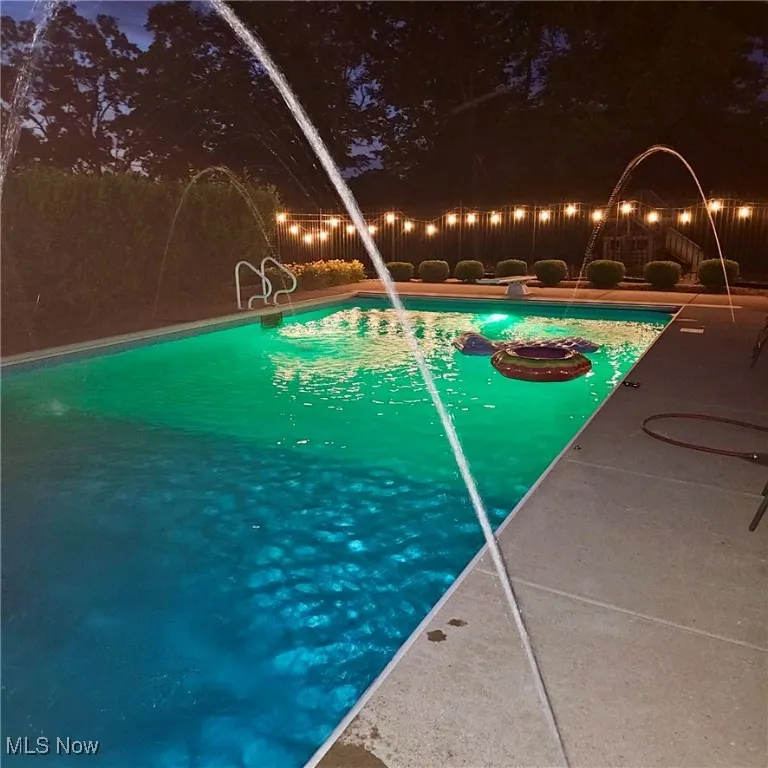 View of pool at night