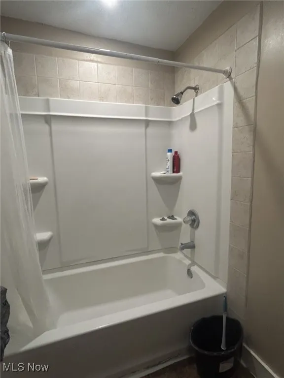 Bathroom featuring shower / bath combo