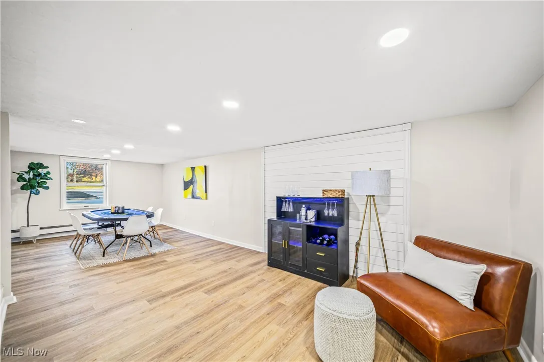 Living area with light hardwood / wood-style floors