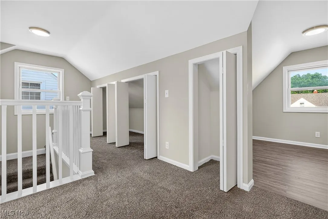 Second floor hallway with closets open