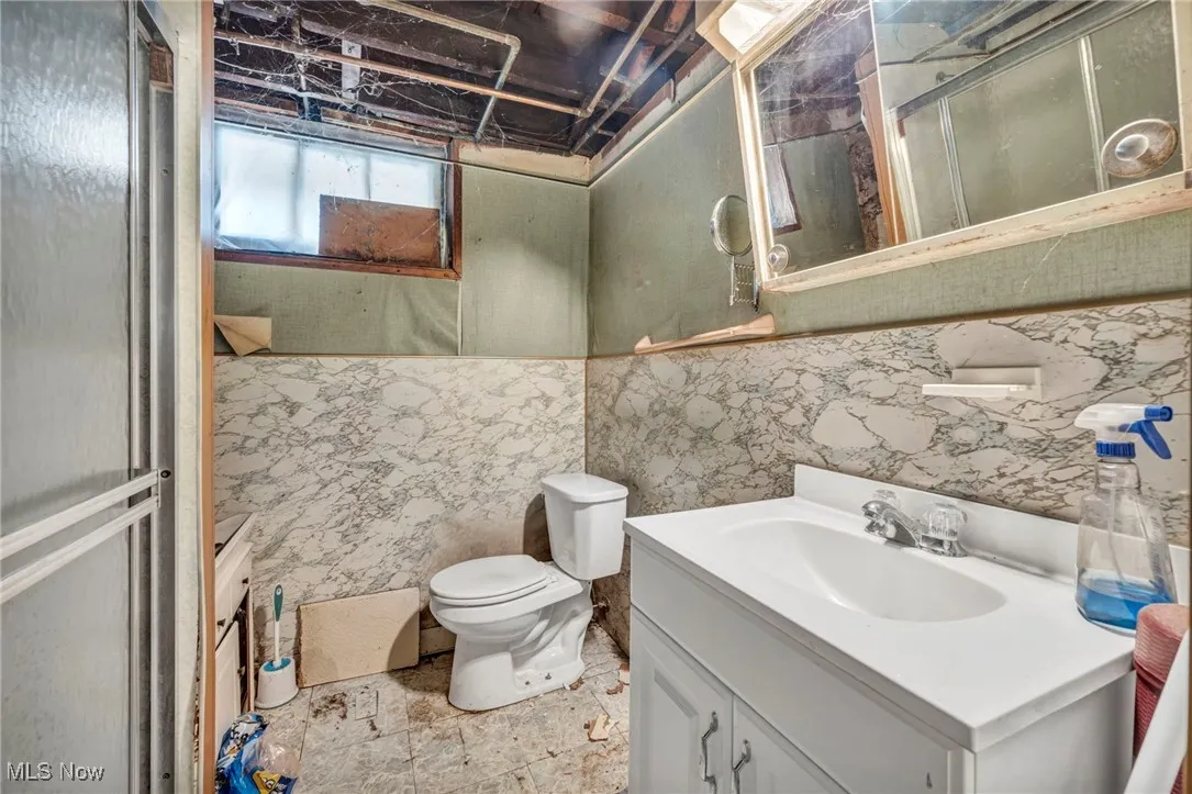 Bathroom featuring vanity and toilet