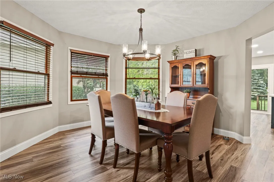 Dining space with a chandelier and light wood-style floors