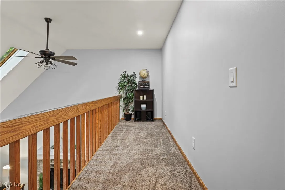 Corridor with carpet, vaulted ceiling, and recessed​​‌​​​​‌​​‌‌​‌‌​​​‌‌​‌​‌​‌​​​‌​​ lighting