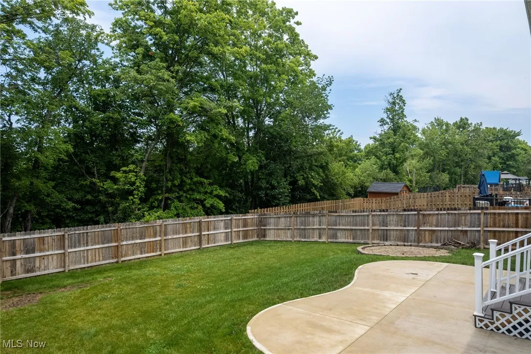 Fenced backyard featuring a patio area