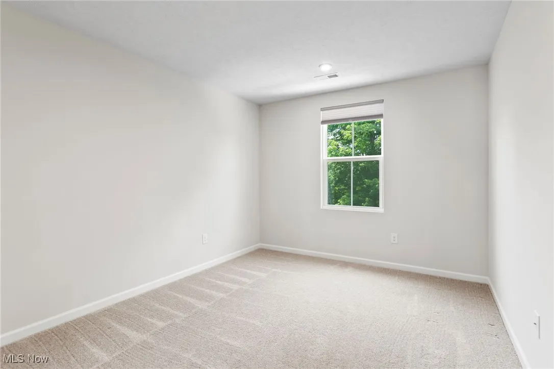 Spare room with light carpet