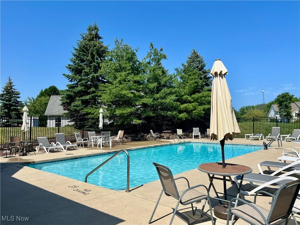 Community pool featuring a patio area