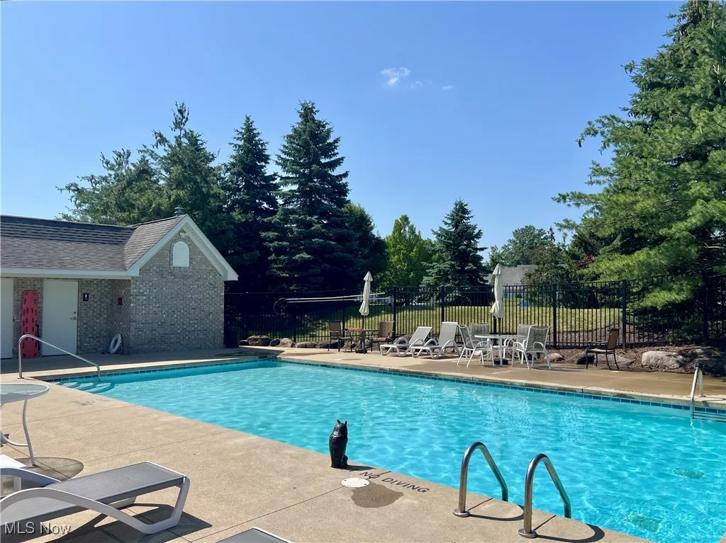 Community pool featuring a patio area