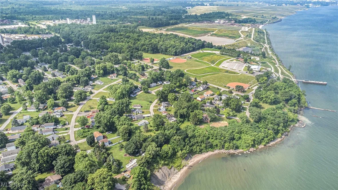 Aerial view of property's location featuring a large body of water