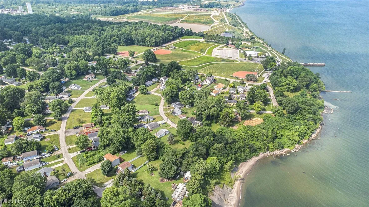Aerial view of property's location with a nearby body of water