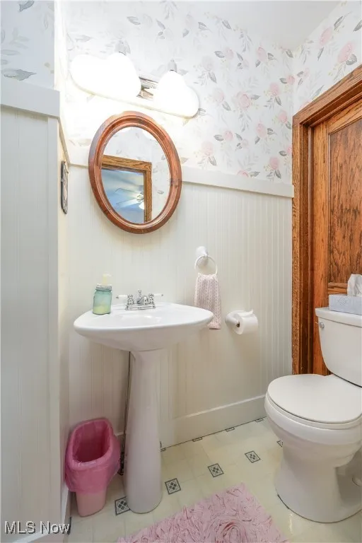 Half bath on the first floor is conveniently located off of the office.