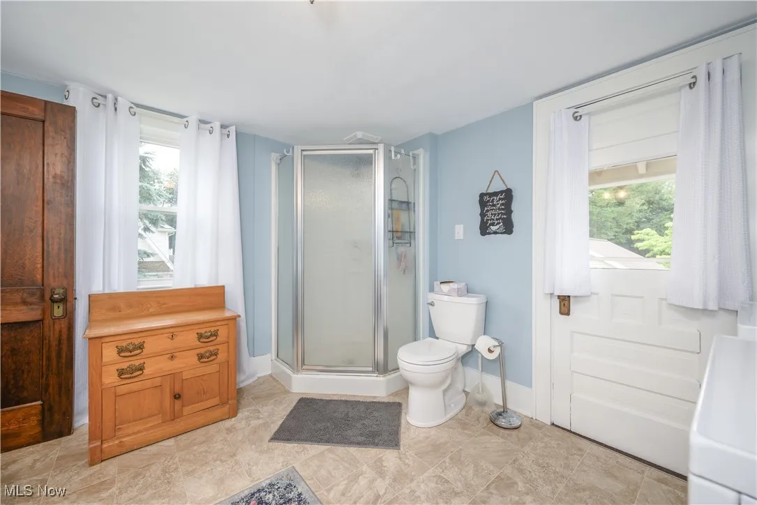 Additional view of Full Bathroom with laundry facilities.