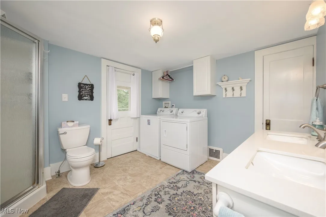 Second Full bathroom (on the 2nd floor) featuring shower, double vanity, laundry (electric dryer hookup) and linen closet. How convenient is this?