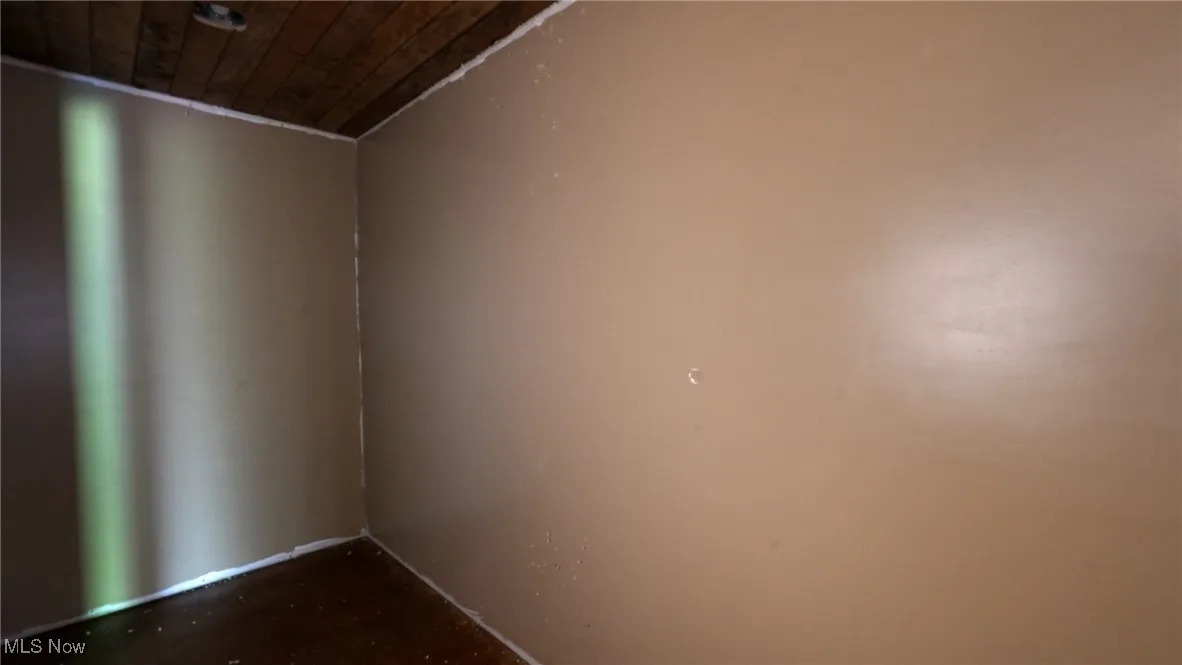 Unfurnished room featuring wooden ceiling