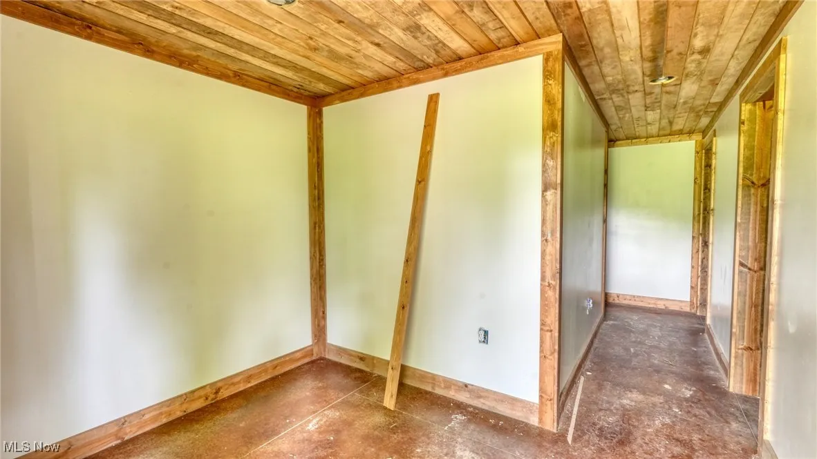Spare room featuring wooden ceiling