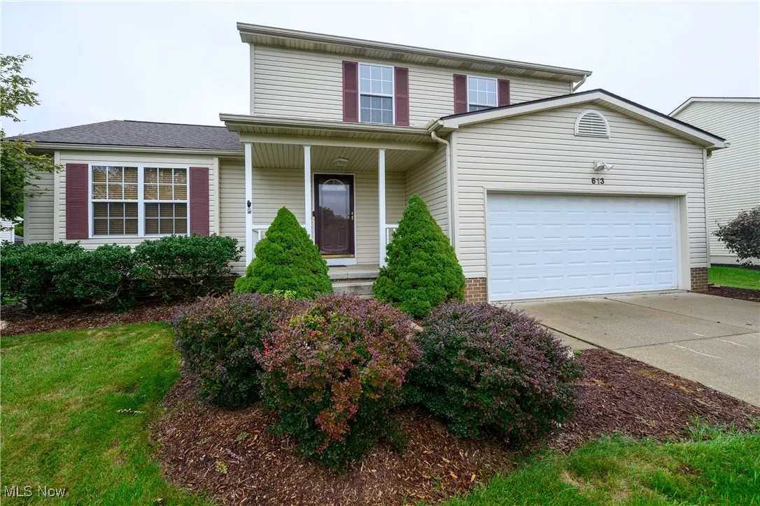 View of front property featuring a garage