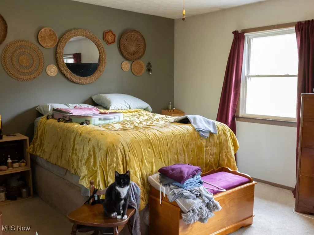 Carpeted bedroom with baseboards