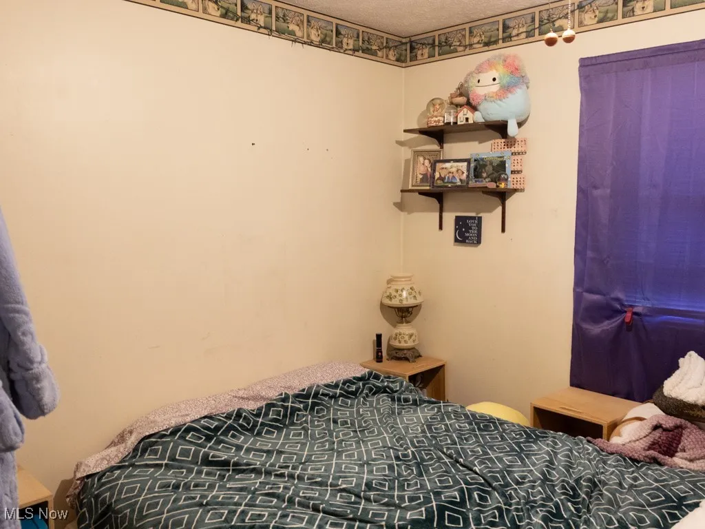 Bedroom featuring a textured ceiling