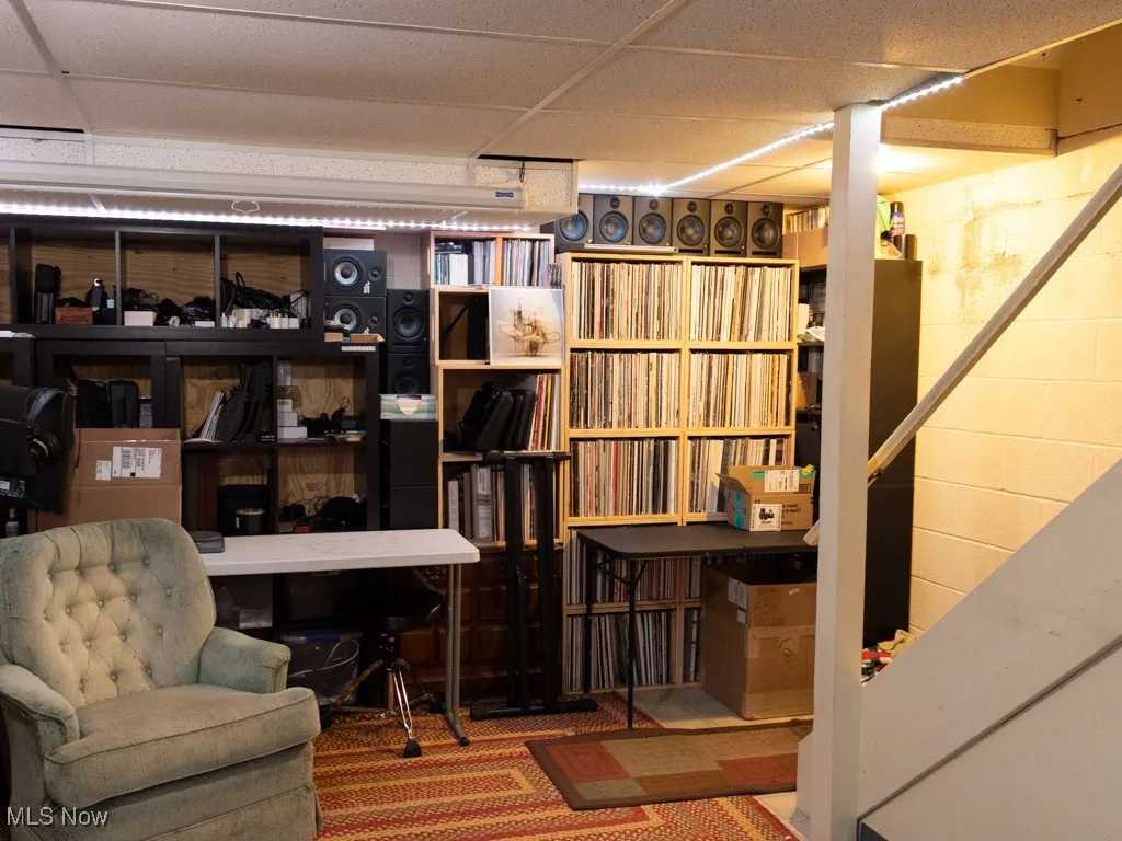 Finished basement featuring a drop ceiling