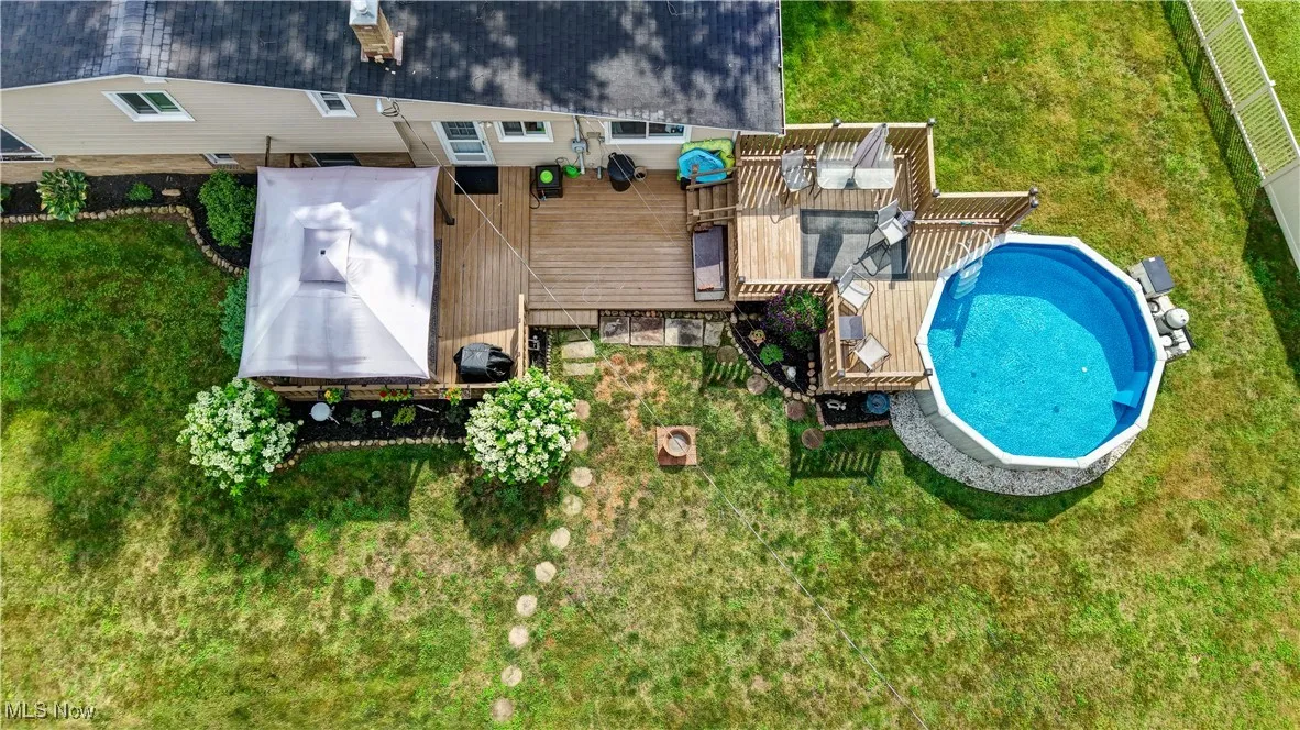 View of subject property with a pool